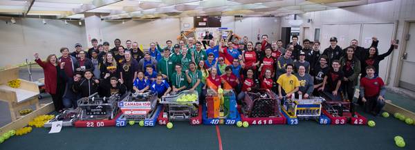 Team picture at sponsor ArcelorMittal Dofasco 's Executive Garage. All local teams sponsored by Dofasco demoed their robots at their robotics showcase