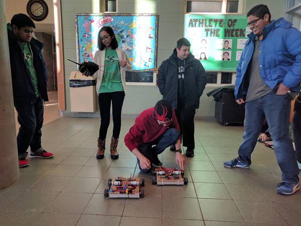 Racing dragsters on kickoff — these remote-control cars were built during the preseason to teach new students the skills needed during build season