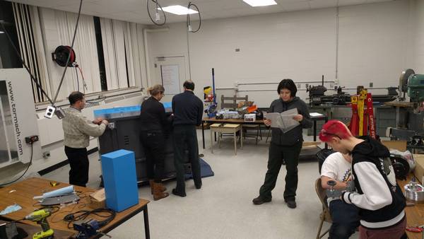 Installing the new laser cutter in the Robodrome's shared machine shop
