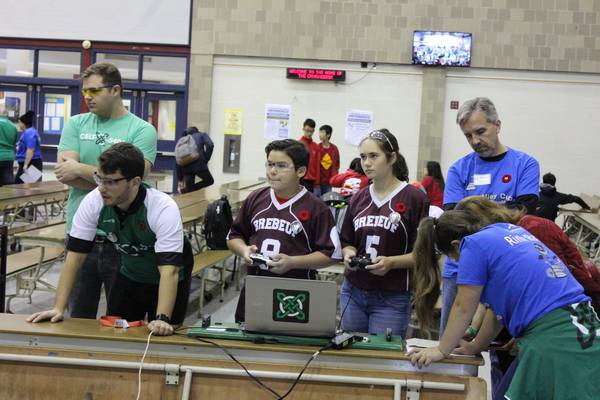 One of our mentors coaching prerookie 6878 SJB Odyssey how to drive a robot at the STEMley Cup