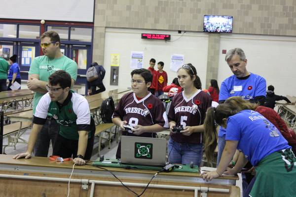 One of our mentors coaching prerookie 6878 SJB Odyssey how to drive a robot at the STEMley Cup