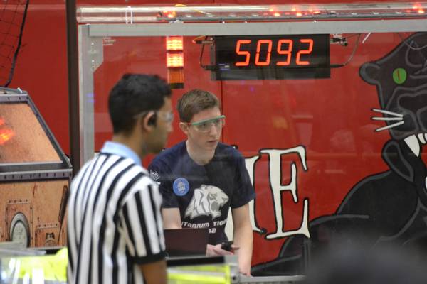 One of our team members driving 5092 Titanium Tigers' robot. Due to religious reasons, they could not compete on the first day of the Victoria Park Collegiate competition, so a couple of our team members drove and maintained their robot for them