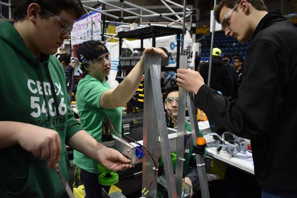 Our roving repair crew helping another team with their robot