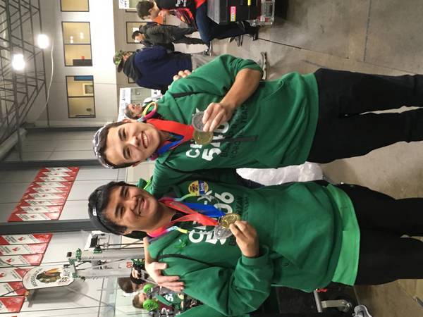 Operator and driver posing with their Ontario District Championship hardware