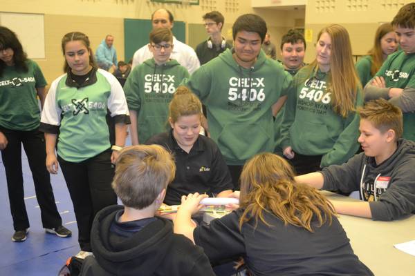 Elementary students testing their build for the BR STEM Day build challenge