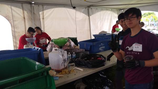 Sorting garbage and recyclables to divert festival waste from the dump